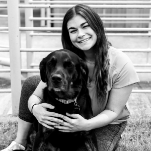 Girl with a black dog